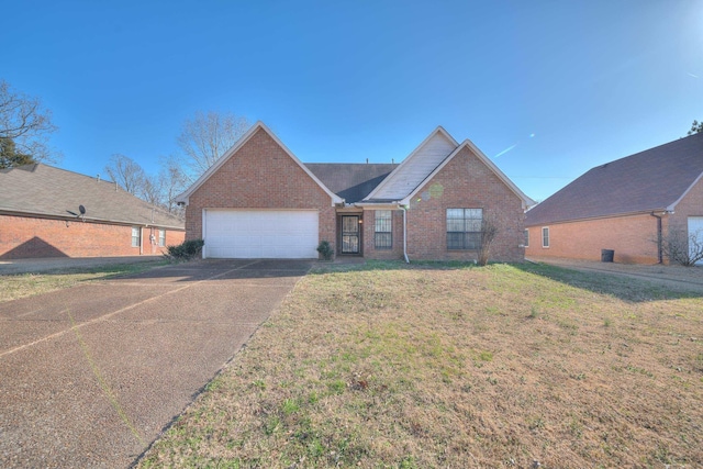 single story home with brick siding, a front lawn, concrete driveway, and a garage