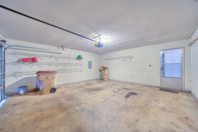 garage with electric panel and a garage door opener