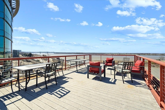 wooden terrace with a water view