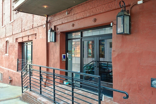 property entrance with brick siding