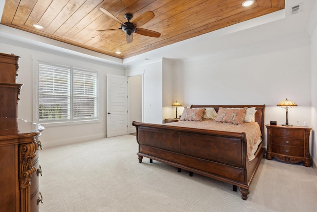 bedroom with visible vents, a tray ceiling, crown molding, light colored carpet, and wooden ceiling