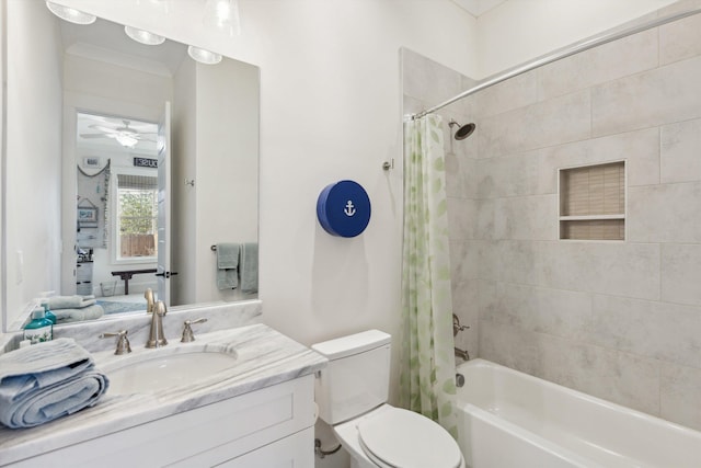 bathroom with shower / bath combination with curtain, toilet, vanity, and a ceiling fan