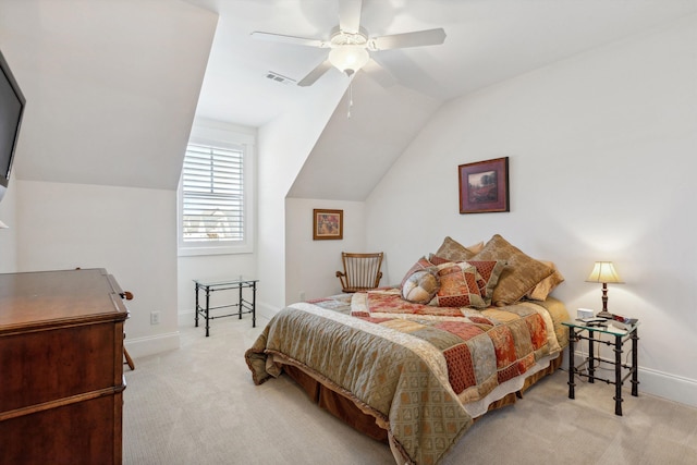 carpeted bedroom with visible vents, baseboards, a ceiling fan, and vaulted ceiling