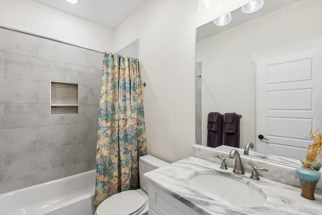 bathroom with vanity, shower / tub combo, and toilet