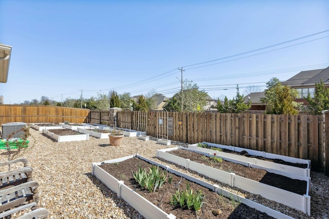 view of yard with a garden, central AC unit, and fence