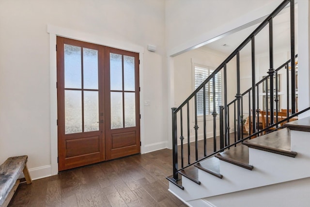 entrance foyer with french doors, wood finished floors, baseboards, and a wealth of natural light