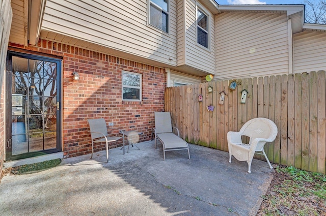 view of patio featuring fence