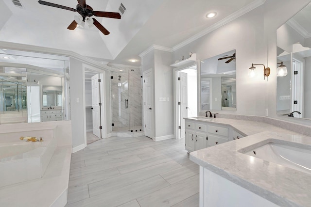 bathroom featuring visible vents, double vanity, a stall shower, ornamental molding, and a sink