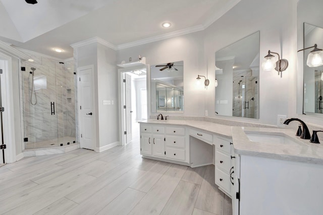 bathroom featuring crown molding, wood finish floors, a stall shower, and a sink