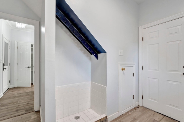 full bathroom featuring crown molding and wood finished floors