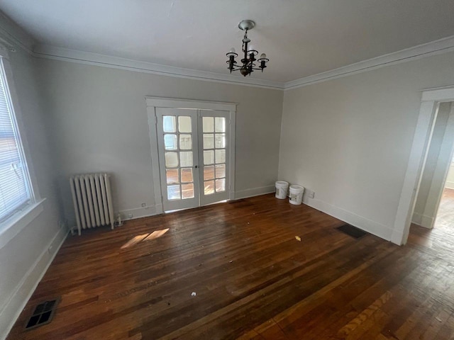 unfurnished dining area with visible vents, radiator, crown molding, french doors, and wood-type flooring