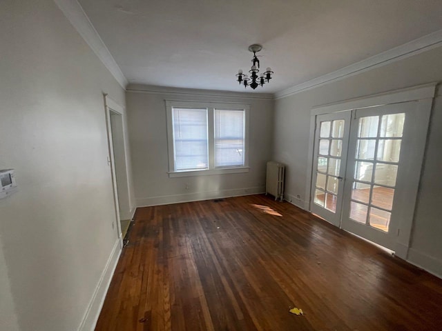 unfurnished dining area featuring radiator heating unit, an inviting chandelier, crown molding, baseboards, and dark wood-style flooring