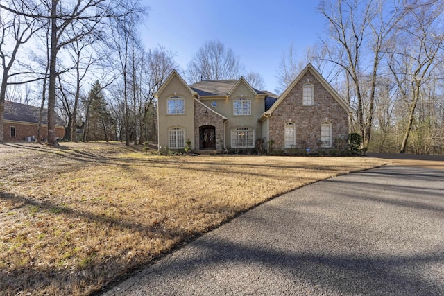 view of front of property with stone siding and stucco siding