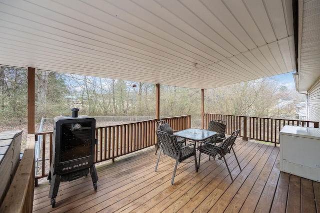 wooden deck with outdoor dining space