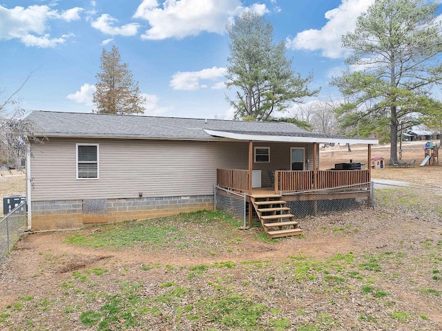 back of property with a deck, central AC unit, fence, and crawl space