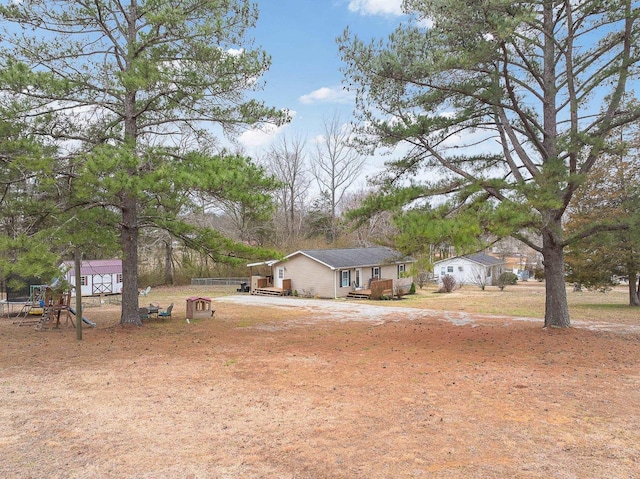 view of front facade with a deck and a playground