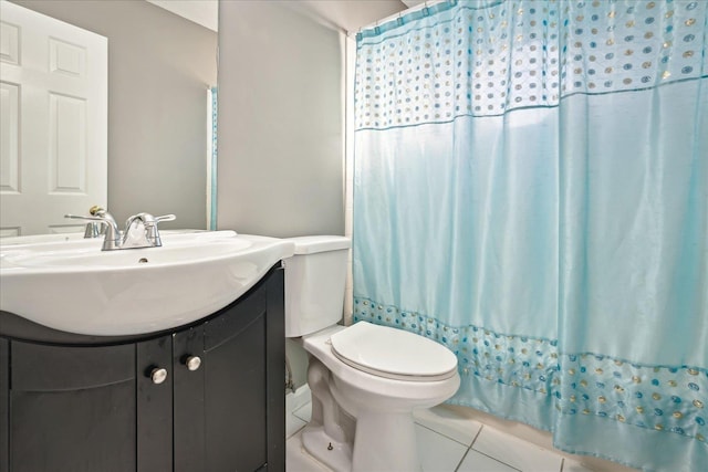 bathroom featuring vanity, tile patterned floors, toilet, and a shower with shower curtain