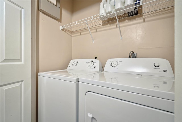 laundry area with laundry area and washer and clothes dryer