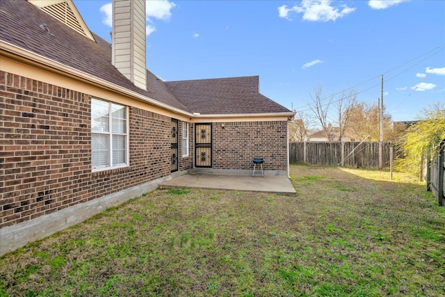 view of yard with a patio and fence