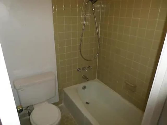 full bath featuring bathtub / shower combination and toilet