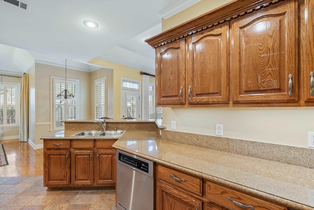 kitchen with brown cabinets, a sink, a peninsula, crown molding, and dishwasher