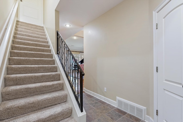 stairway featuring recessed lighting, visible vents, and baseboards