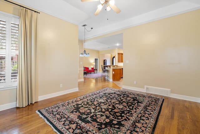 unfurnished room featuring light wood-type flooring, visible vents, and plenty of natural light