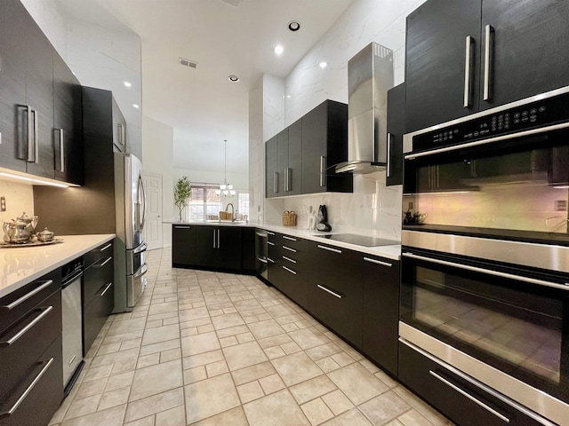 kitchen featuring modern cabinets, visible vents, appliances with stainless steel finishes, and dark cabinetry