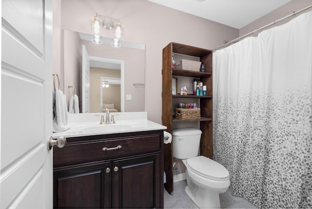 bathroom with vanity, tile patterned floors, toilet, and a shower with shower curtain