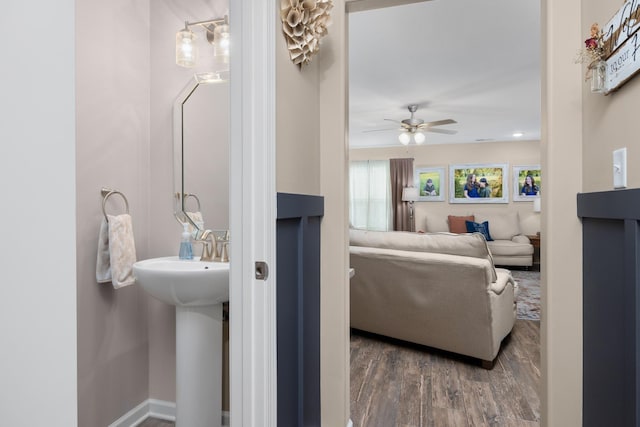 bathroom featuring ceiling fan and wood finished floors