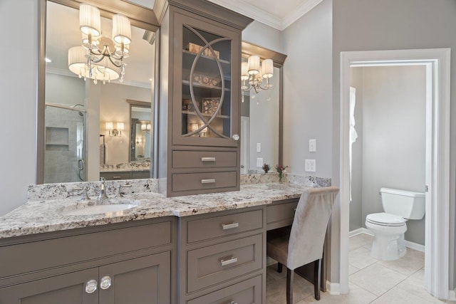 bathroom with vanity, a stall shower, crown molding, toilet, and tile patterned floors