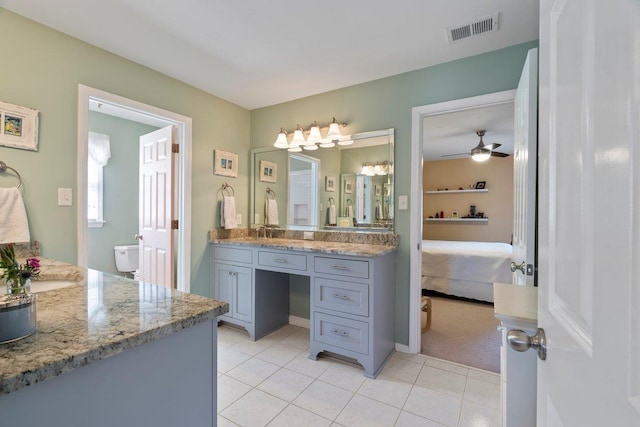 ensuite bathroom featuring tile patterned floors, visible vents, ensuite bathroom, a ceiling fan, and vanity