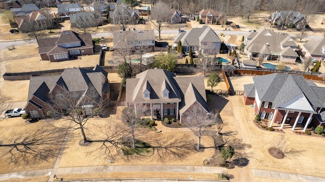 birds eye view of property with a residential view