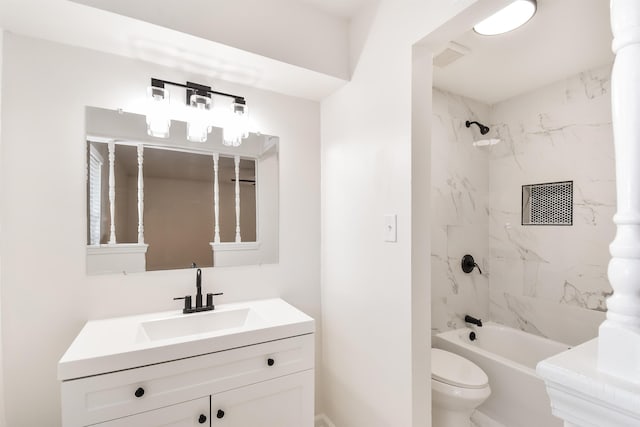 bathroom featuring visible vents, toilet, vanity, and shower / tub combination