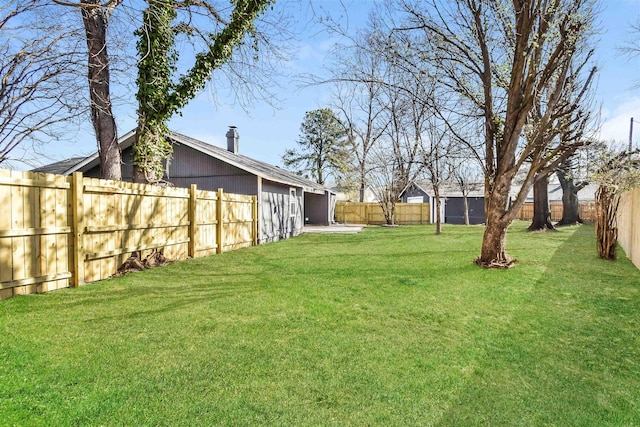 view of yard featuring a fenced backyard