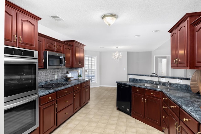 kitchen featuring visible vents, dark brown cabinets, light floors, appliances with stainless steel finishes, and a sink