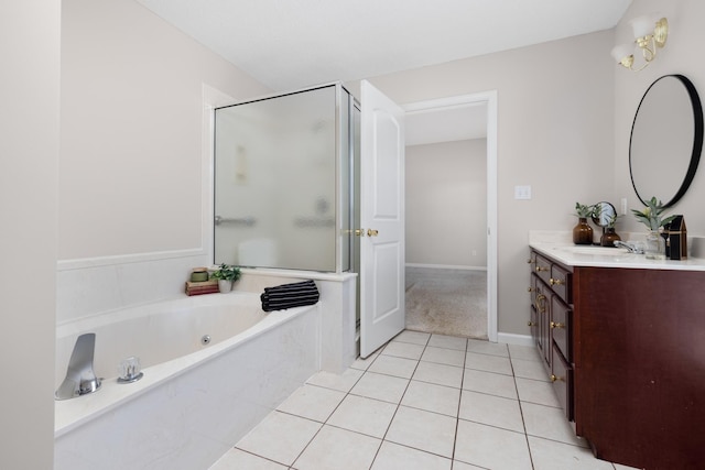 full bath featuring a shower stall, baseboards, a garden tub, tile patterned floors, and vanity