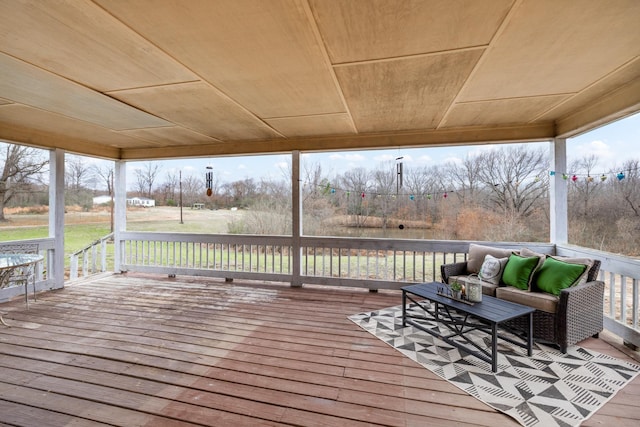 wooden terrace featuring outdoor lounge area