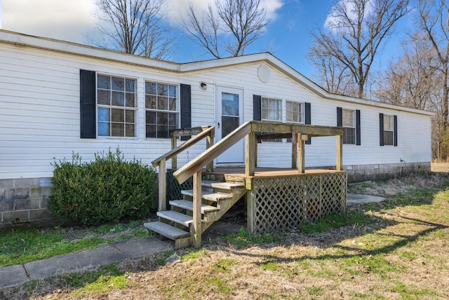 view of front of property featuring a wooden deck