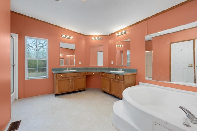 full bathroom featuring a shower stall, a garden tub, visible vents, and a sink