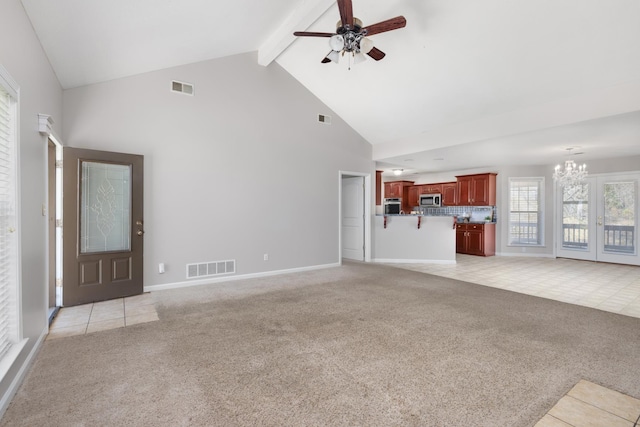 unfurnished living room featuring light carpet, visible vents, beamed ceiling, and high vaulted ceiling