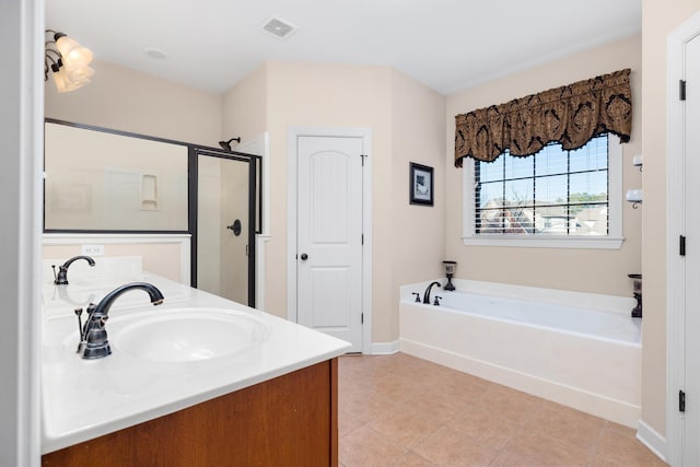 full bathroom featuring visible vents, double vanity, a stall shower, a bath, and a sink