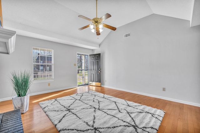 bedroom with wood finished floors, baseboards, visible vents, ceiling fan, and vaulted ceiling