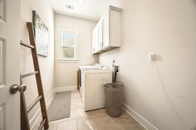 laundry room featuring washer and dryer, visible vents, baseboards, and light tile patterned floors