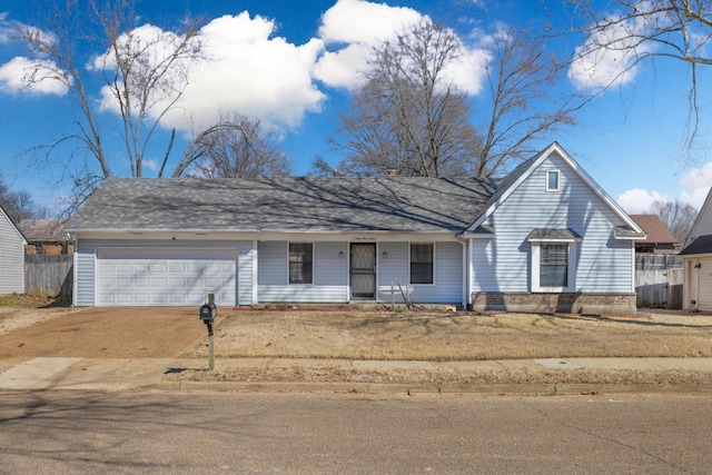 ranch-style home with a garage, fence, dirt driveway, and a shingled roof