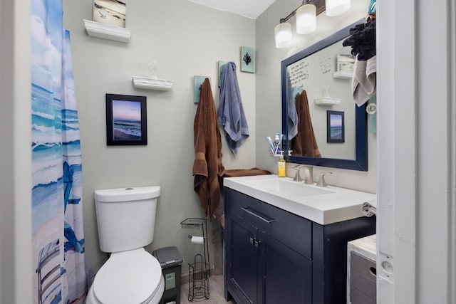 full bathroom with toilet and vanity