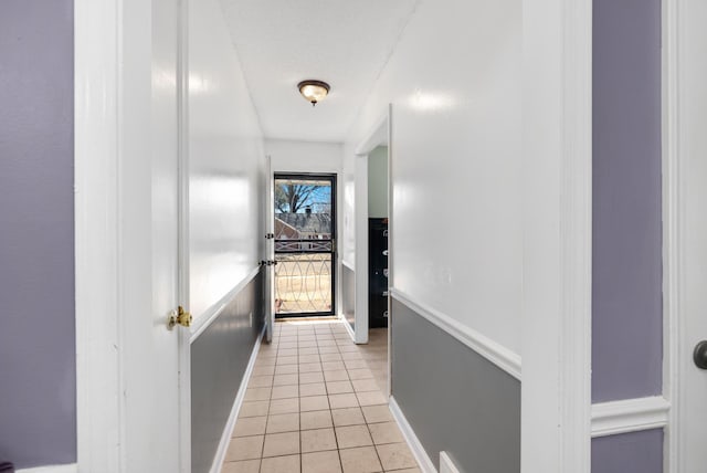 hallway with light tile patterned floors