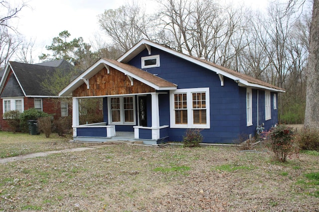 view of front of house featuring roof with shingles