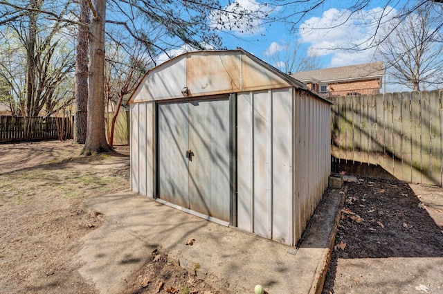 view of shed featuring a fenced backyard