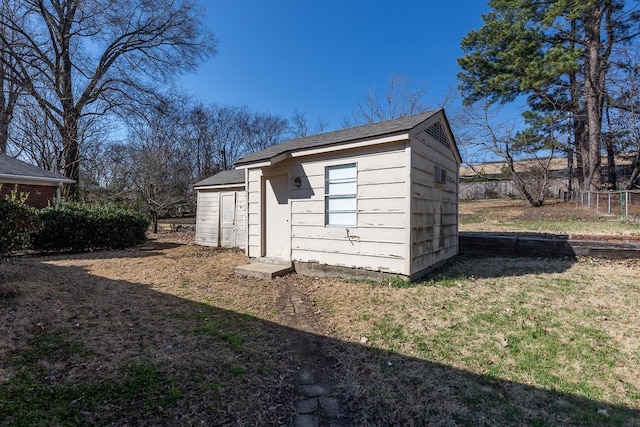 view of shed with fence